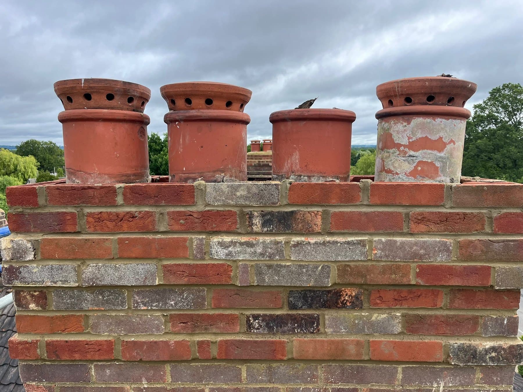 Chimney stack rebuilt with its four pots