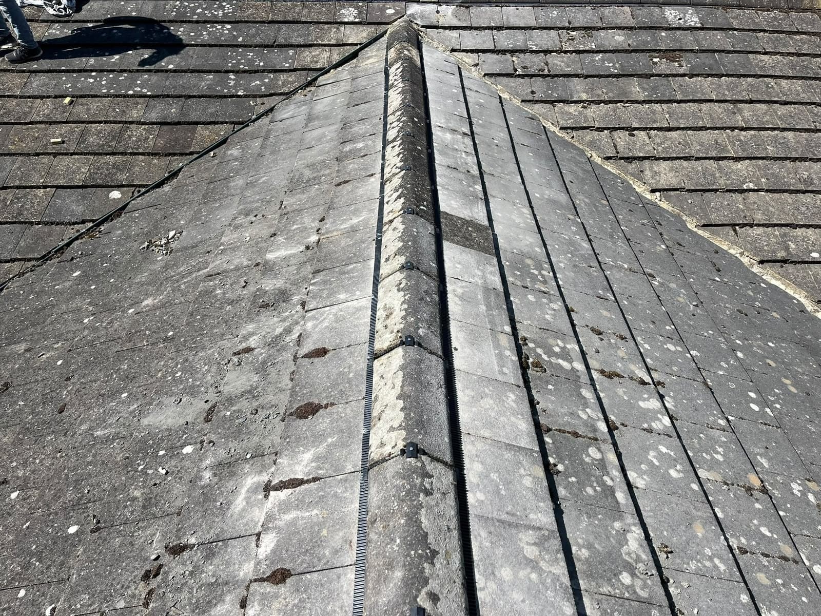 Ridge line running down a dark tiled roof