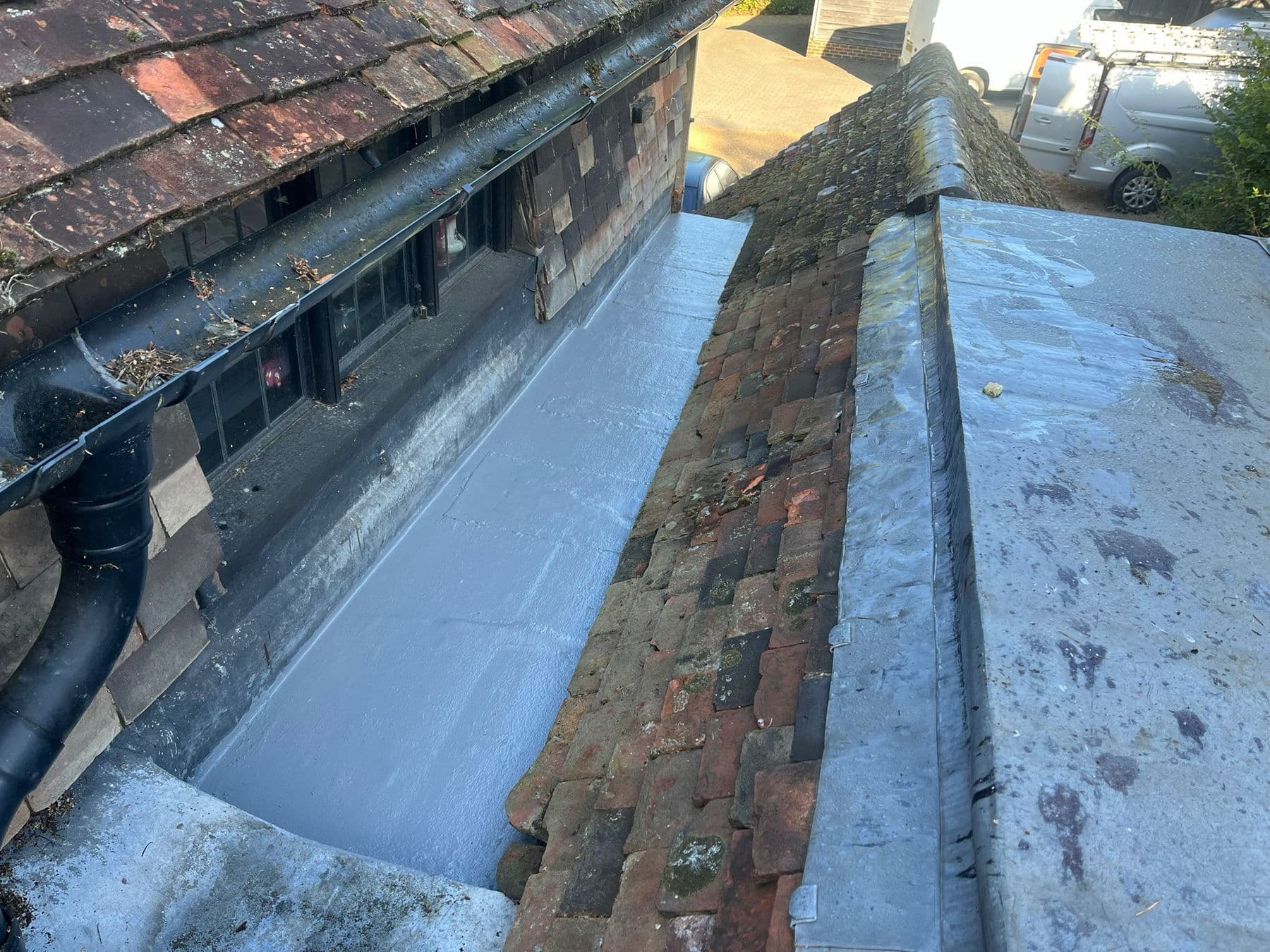 New lead valley dressed into a tiled roof